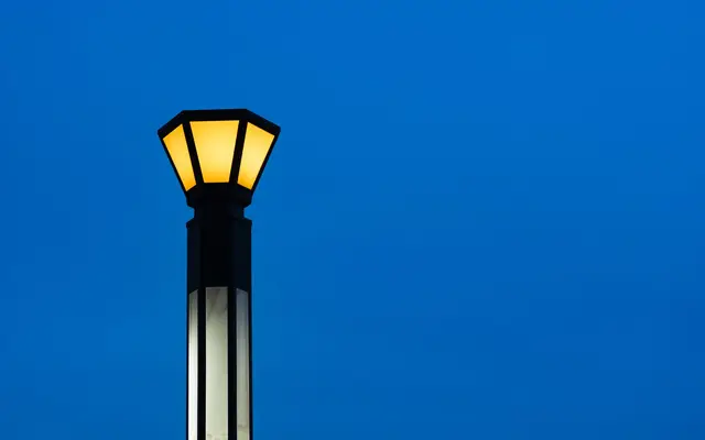 Professional garden lighting fixtures providing homogeneous light distribution on a modern pathway